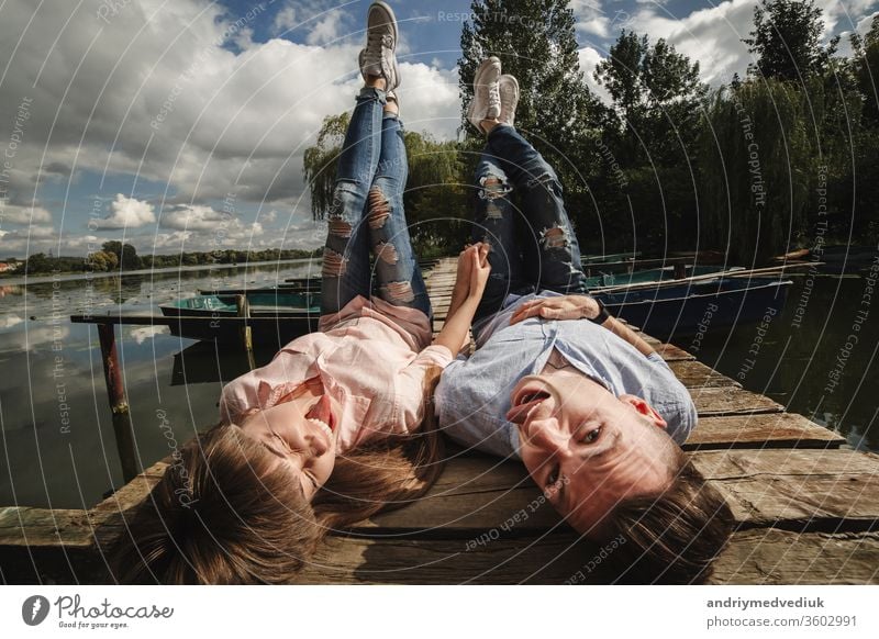 crazy young couple emotionally having fun, kissing and hugging outdoors. Love and tenderness, romance, family, emotions, fun. having fun together beach happy