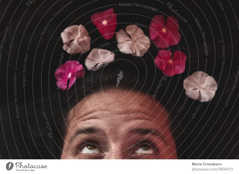 Conceptual photo of man with a flower crown showing concept of Spring, sexuality, lgbtq community and pride month celebration spring concept conceptual portrait