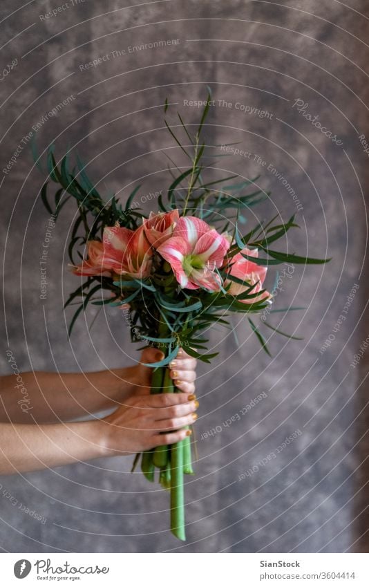 Woman hands hold a bouquet with flowers. woman beautiful soft light girl white wedding dress vintage young cute pink happy holding modern hair model beauty