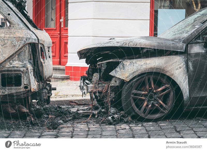 Burned out cars in the streets of Berlin accident attack background berlin blaze broken burn burned burning city crime damage danger dangerous destroyed