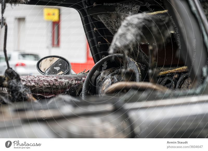 melted steering wheel of a burnt out car accident attack background berlin blaze broken burned burning city crime damage danger dangerous destroyed destruction