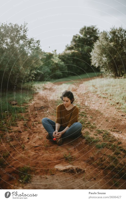 Woman Sitting On Dirt Road sitting sitting on floor road waiting Wait female Loneliness Feminine Relaxation woman legs alone Lovesickness travel thinking