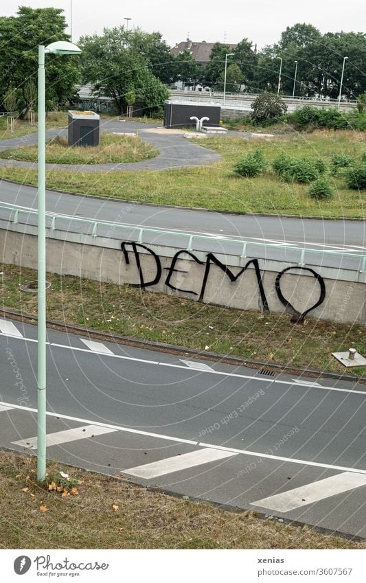 Demo - Grafitti between streets with lanterns on a wall graffiti Street Lantern Green space Wall (barrier) Demonstration Society Fear of the future Vandalism