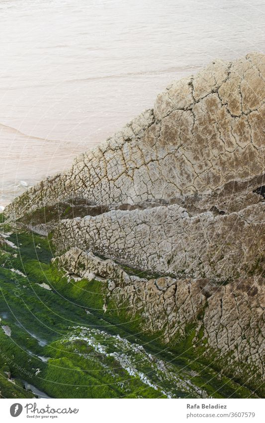 Beautiful green rock near the beach Beach Ocean Coast Rock travel coastline water españa stone seascape ocean reflection spain Sunlight landscape