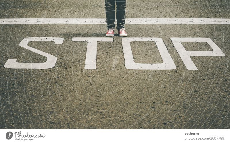 sneakers near the stop marking of the road trendy foot people route traveler halt adventure explore footwear sign single stall casual style modern lifestyle