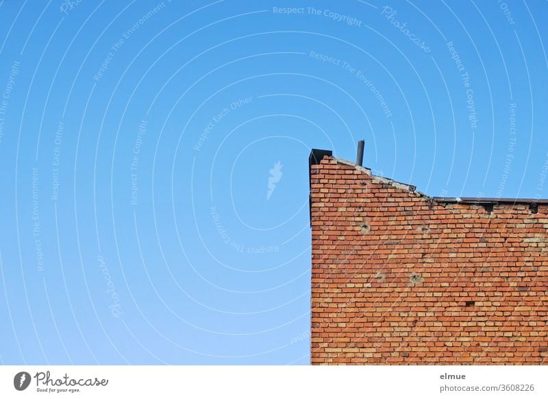 Partial view of an old red brick building and blue sky built Blue sky Brick construction clear lost places Facade Past Wall (building) brick wall Decline