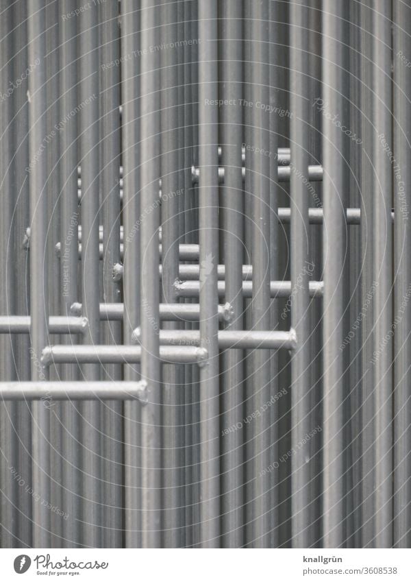 Close-up of several barrier grids standing one behind the other Protective Grating Barrier Safety Protection Exterior shot Fence Metal Border