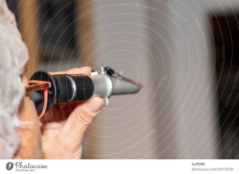 Testing the water content in honey with a refractometer Bee-keeping Bee-keeper keep beekeepers Honey honey production organic farming ecologic Honey bee Food