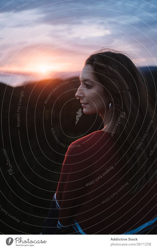 Woman on high terrace against sunset light woman lookout twilight ocean deck shore alone harmony sea national park evening la mauricie quebec canada sundown