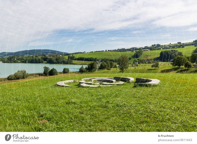 Stone sculpture at the lake, landscape Lake Water Calm Sky Landscape Austria Salzkammergut mad Summer Meadow Sculpture panorama Lakeside Nature Deserted