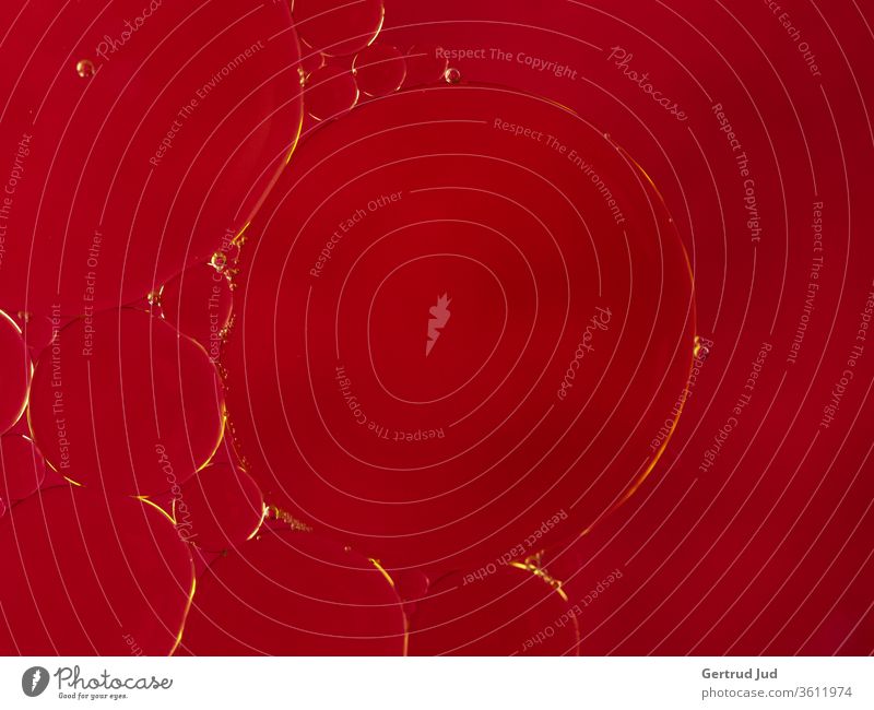 Oil drops on water in red Abstract Colour bright Oil Drops Colour photo Red variegated shape Oil slick Surface of water Drops of water colour red
