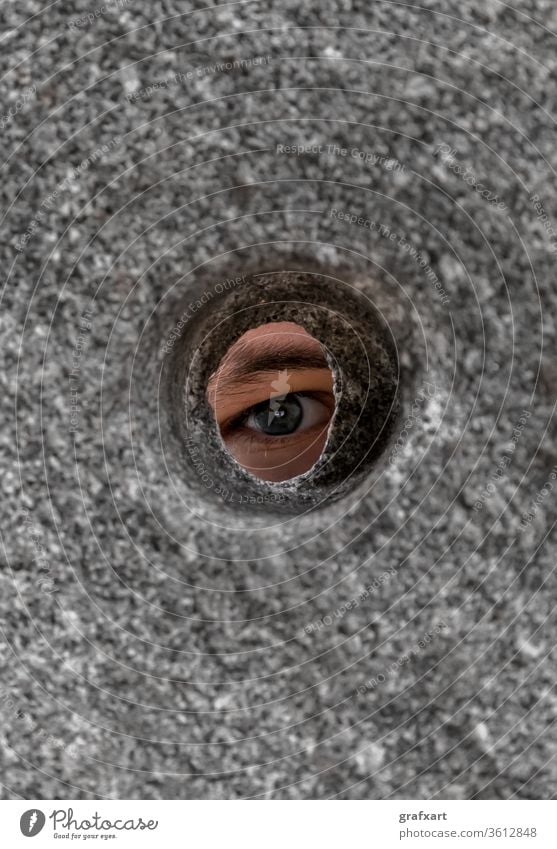 Eye Looks Curiously Through Round Hole In Stone Wall anxiety anxious background behind check concept crime curiosity curious emotion eye eyeball eyebrow eyelash