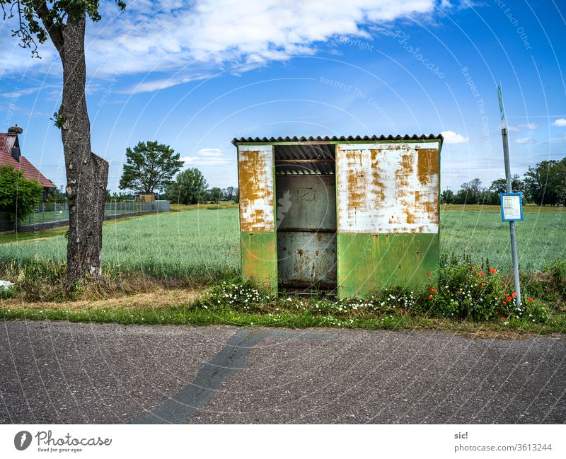 Bus shelter in the country Bus stop shelter Schedule (transport) Stop (public transport) Sky tree House (Residential Structure) Stork's Nest Grain Street Clouds