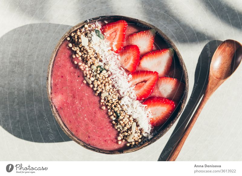 Strawberry Smoothie in Coconut Bowl smoothie healthy bowl coconut detox banana strawberry raspberry food vegan granola fruit breakfast organic oat yogurt pink