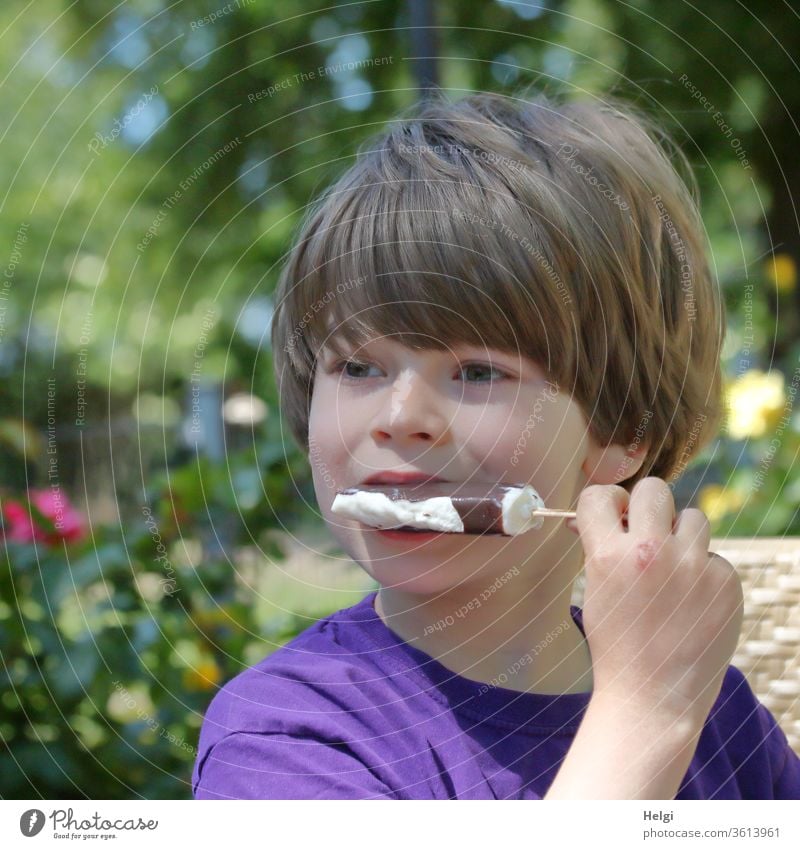 that tastes good! - Portrait of a child eating a popsicle Child Boy (child) Infancy portrait Ice ice on a stick Face hair Hand stop To hold on Eating Ice cream