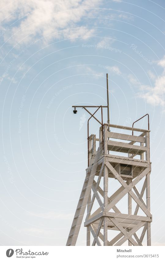 Lifeguard Tower with a Bright Blue Sky lifeguard sky lifeguard tower Beach Ocean Coast Exterior shot Day Sunset Vacation & Travel Sand Summer Relaxation Nature