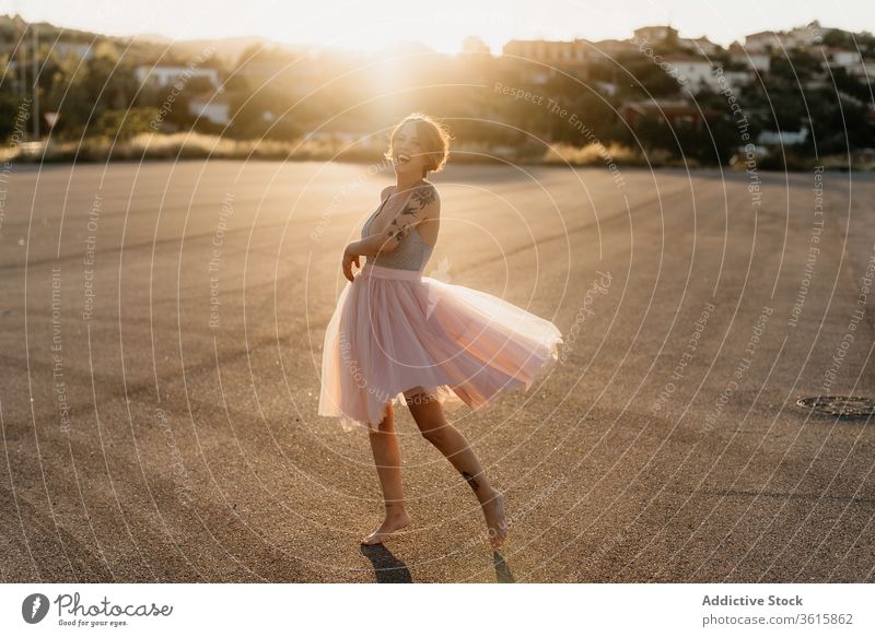 Happy woman dancing on street dancer happy delight artist elegant grace cheerful young sunset female summer smile joy optimist laugh excited move glad positive