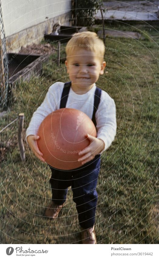 A little boy plays with the ball in the garden Boy (child) Child Human being Colour photo Infancy Playing Happiness Toddler Cute Joy luck Garden Ball