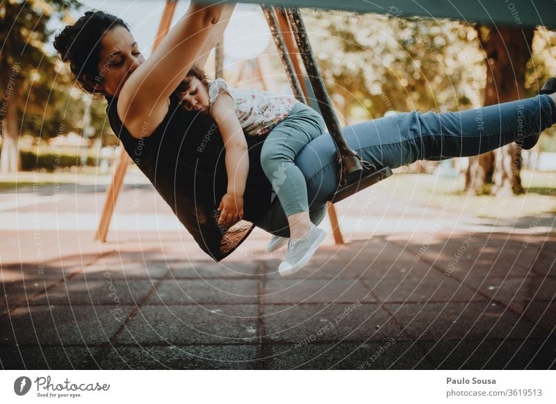 Mother and Daughter on a swing motherhood Mother's Day Mother with child Child Together togetherness Childhood memory Family & Relations Parents Infancy Happy