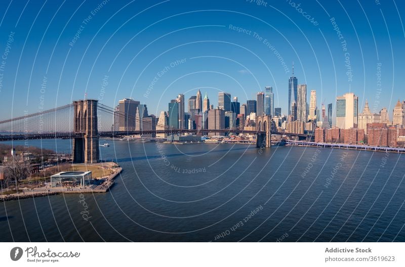 Modern cityscape with bridge over river new york skyline skyscraper building brooklyn modern architecture urban district downtown famous landmark water