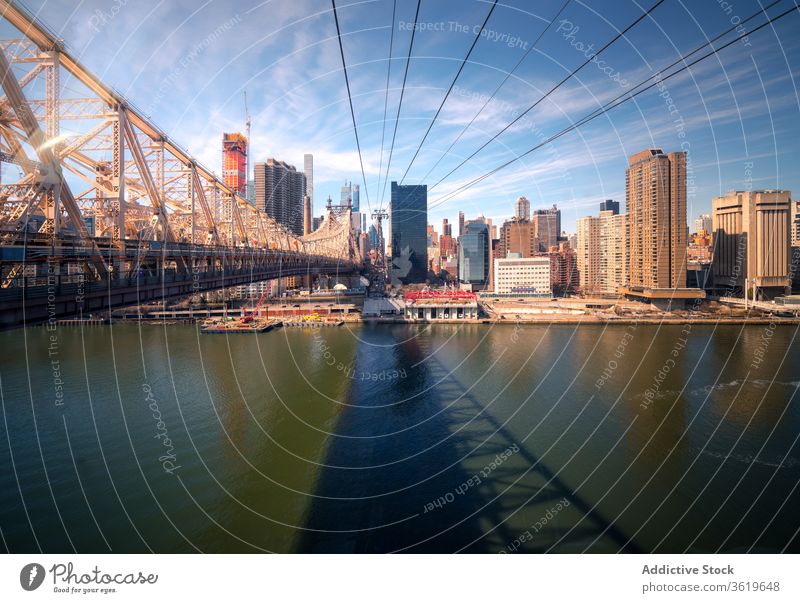 Suspension bridge over river in city architecture building structure design style construction suspension new york travel tourism usa skyline skyscraper modern