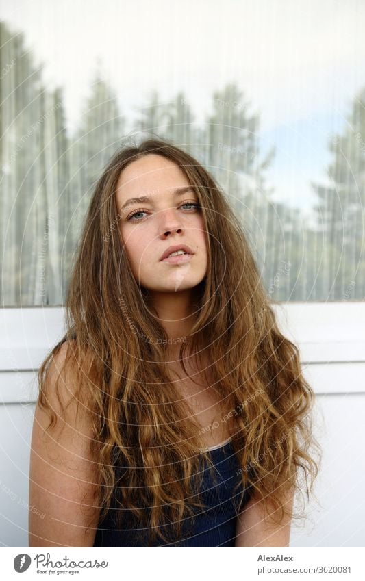 Portrait of a young woman in front of a window pane Young woman Woman Youth (Young adults) Feminine already Face 18 - 30 years Human being Colour photo