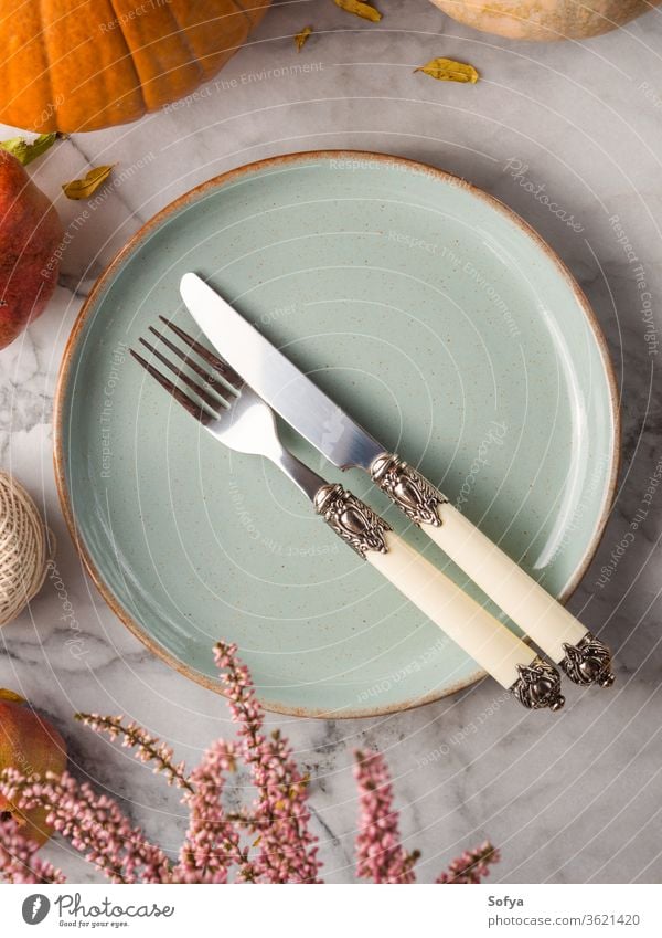 Autumn table setting. Vertical shot thanksgiving food autumn invitation design november party rustic silverware halloween fall marble moody orange dinnerware