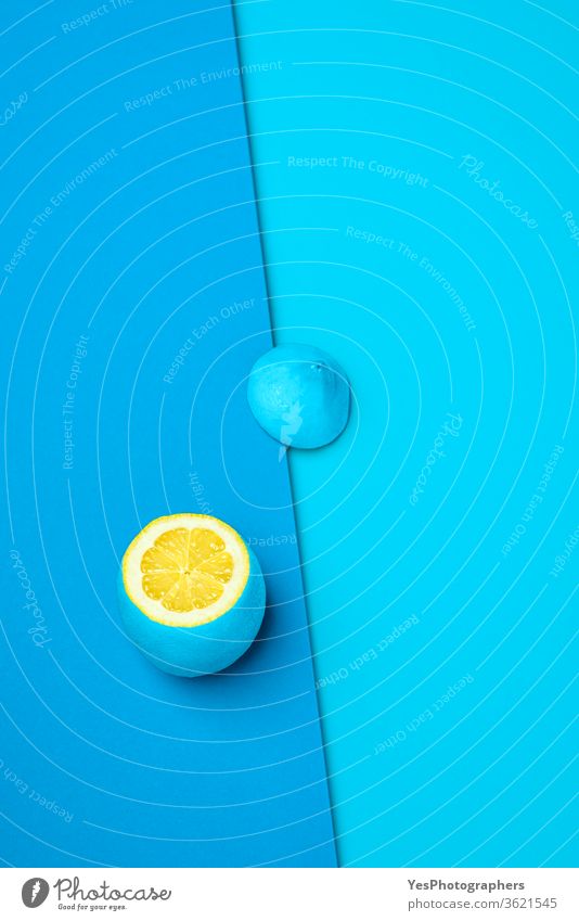 Blue lemon section top view. Fresh citrus on blue background. abstract blue lemon bright color colorful colorized concept contrast contrasting copy space