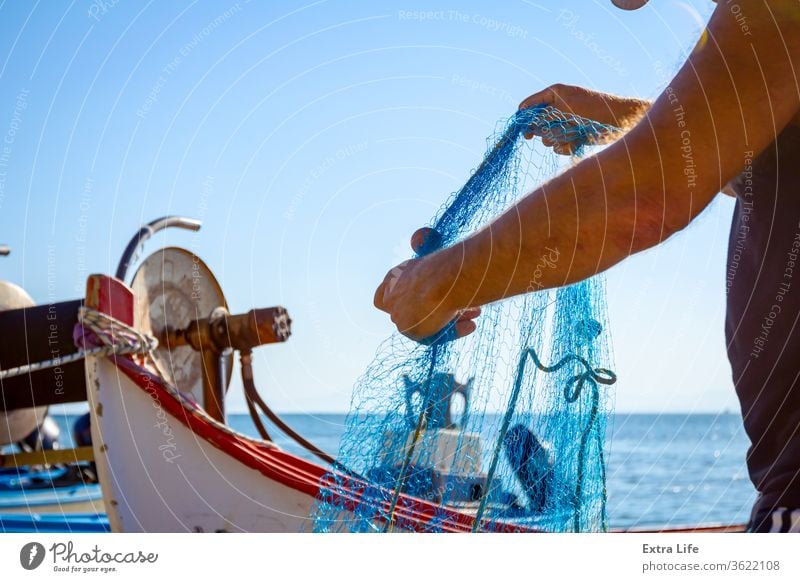 Fisher pile up fishing net at sandy beach Along Angling Arrange Ashore Beach Boat Bunch Catch Check Coast Coastline Drag Dry Docked Effort Empty Entrap