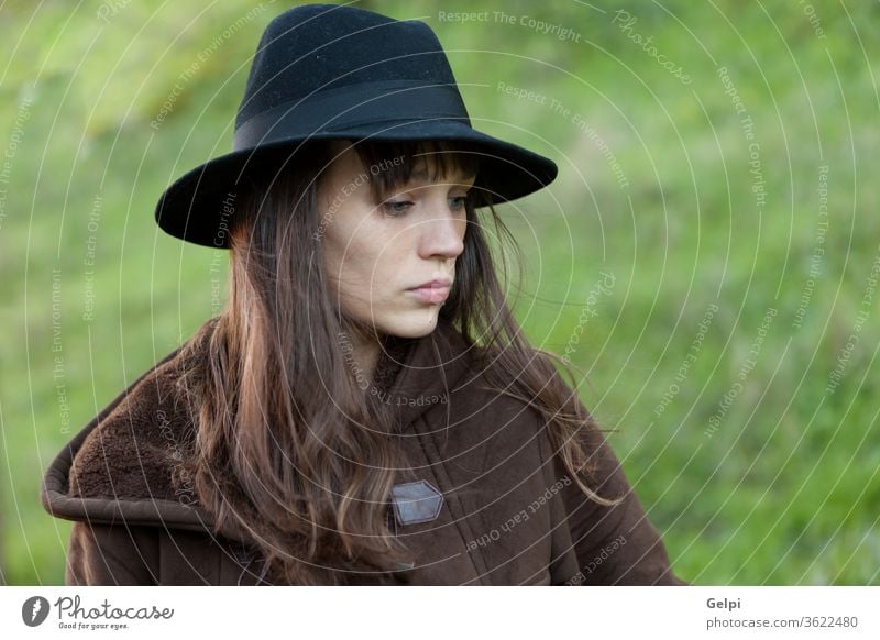 Sad woman with black hat beautiful sad person portrait young lifestyle girl female pretty beauty attractive people fall caucasian autumn model lady face outdoor