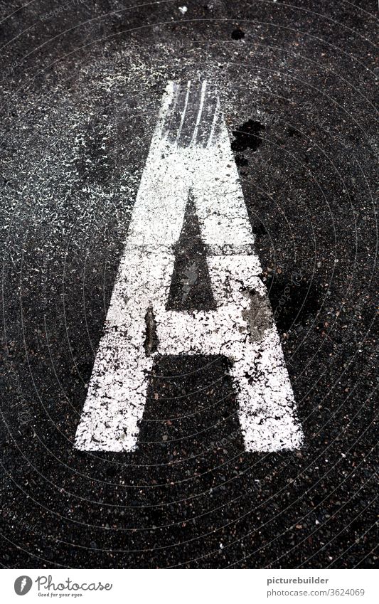 Letter A letter Exterior shot Asphalt alphabet Lane markings White Day Light Portrait format start Street Bird's-eye view Structures and shapes Contrast