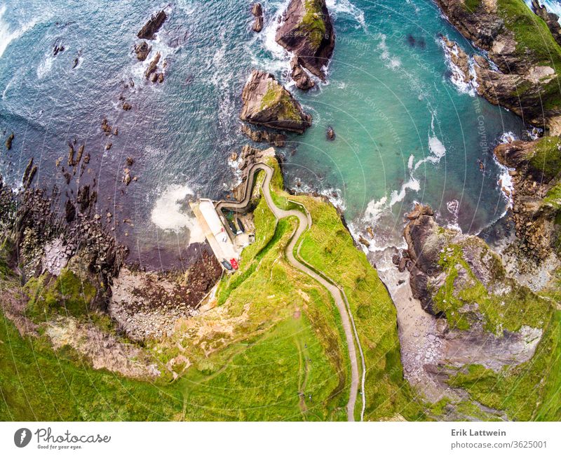 Amazing aerial view over Dunquin Pier Ireland on Dingle Peninsula Slea Head Vacation coast landscape nature ocean sea travel Kerry scenic summer water blue rock