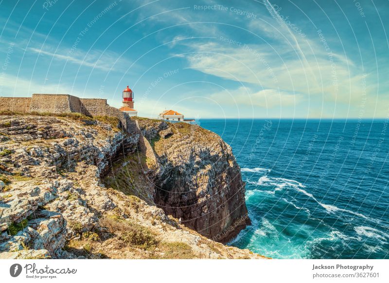 Lighthouse at the end of Saint Vincent Cape, Portugal lighthouse portugal ocean algarve rocks waves architecture atlantic beacon beautiful blue building cape