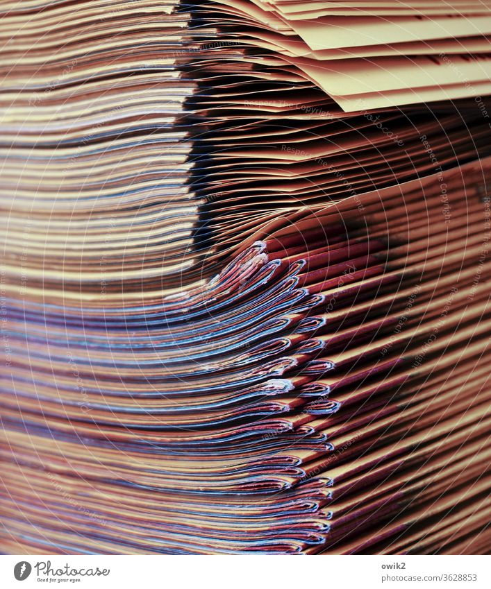 Media hype newspapers Stack Many quantity mass Supply stacked variegated stapled Folded Arrangement Exterior shot Paper Print media Piece of paper