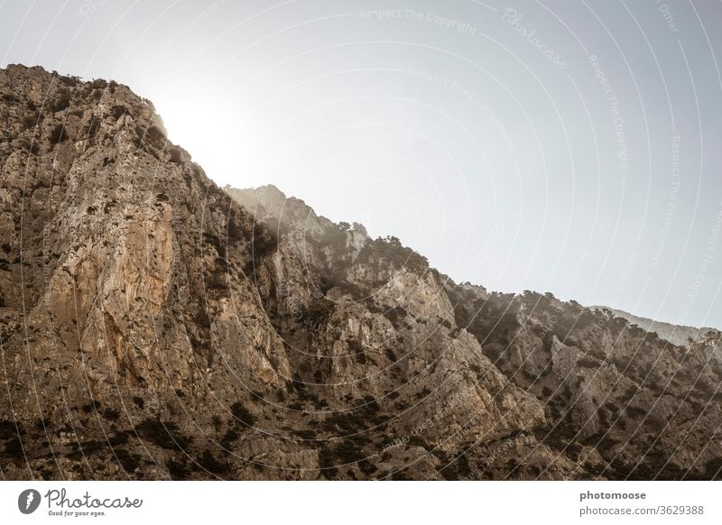 Mediterranean mountain range at sunrise Crete Rock Sun Summer Summery mountains Rock formation stone Environment Day Copy Space top Deserted Sky Mountain