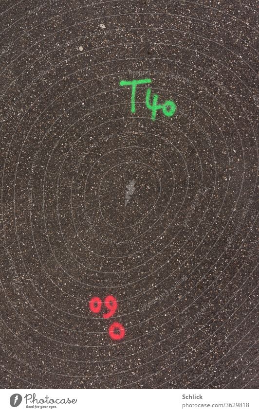 Surveying Geodesy Letters and numbers in luminous paint on asphalt Asphalt figures Surveying technology geodesy Fluorescent color Illuminate green Red Plain