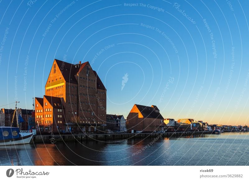 The city harbour in Rostock in the morning Town River ship Mecklenburg-Western Pomerania Warnov Harbour Architecture houses built boat Landmark