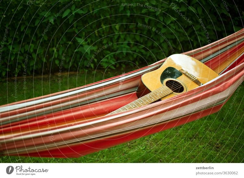 Guitar in the hammock Relaxation holidays Garden Grass allotment Garden allotments Deserted Nature Plant Lawn tranquillity Garden plot Summer trunk shrub