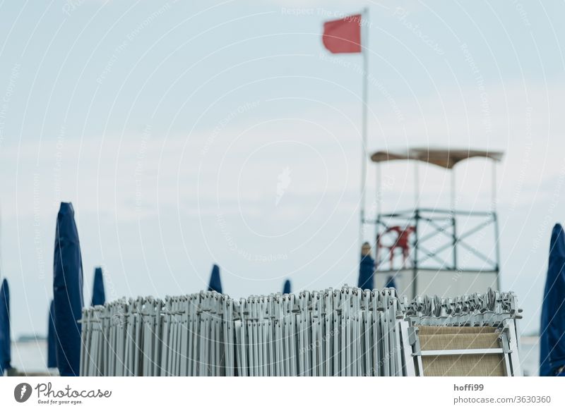 On the beach the sunbeds are caught up again - end of work. Deckchair Beach life Sunshade Couch Cliche Maritime Vacation & Travel Wellness Shadow Sky Ocean