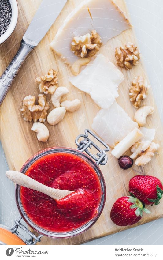 Top view of strawberry jam sweet jar jelly fresh fruit cheese food ingredient marmalade preserve homemade dessert breakfast delicious healthy glass tasty