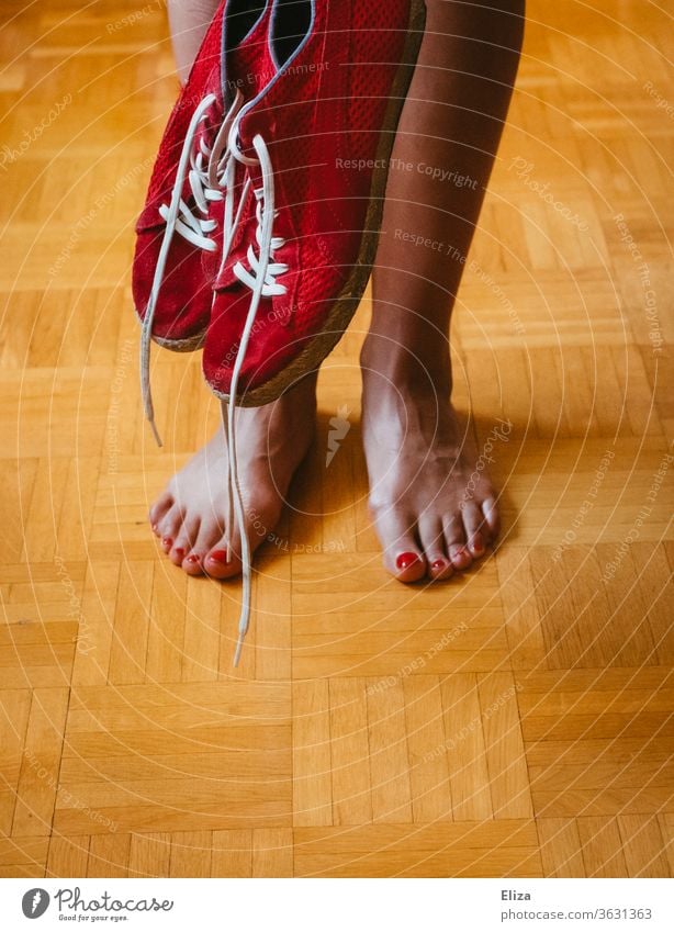 The legs and feet of a woman and red sneakers foot Barefoot Red Woman Legs red nail polish Varnished Zegnails Feminine Nail polish Skin sweaty feet Footwear