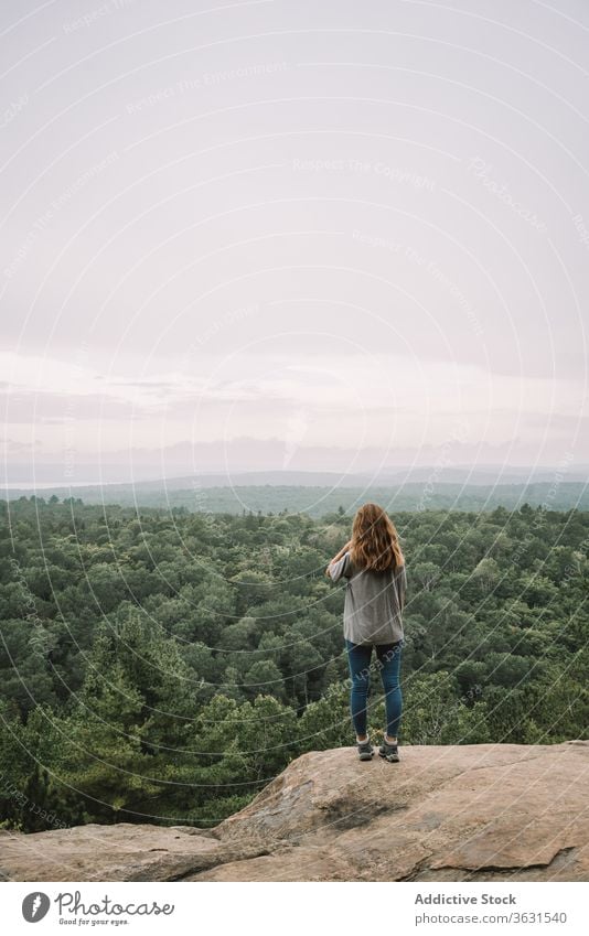 Relaxed woman enjoying view from mountain forest nature relax stand travel hike algonquin provincial park landscape lake river sunny admire tranquil harmony