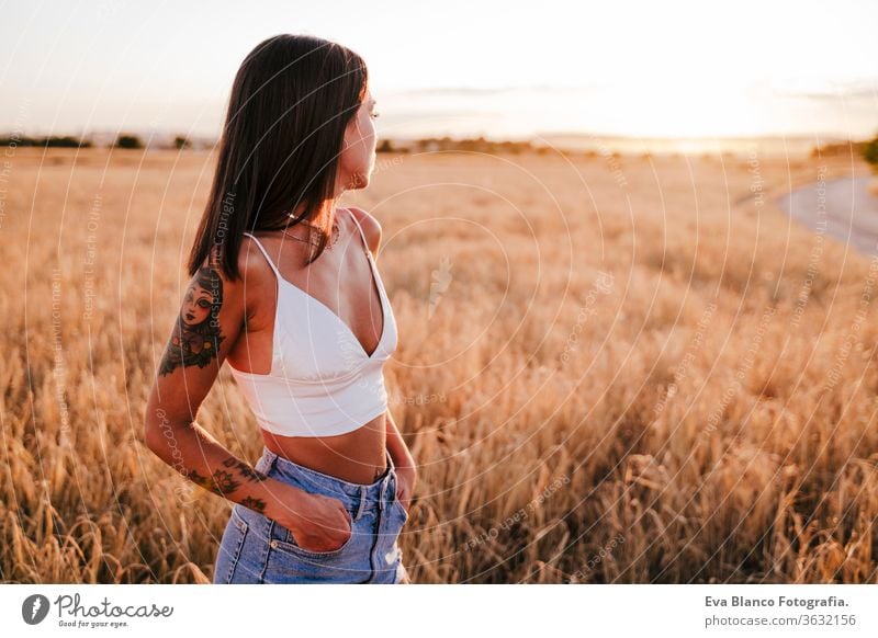 portrait of beautiful woman in a yellow field at sunset. Summer time relax sunrise caucasian blessing female carefree young lifestyle nature summer vitality