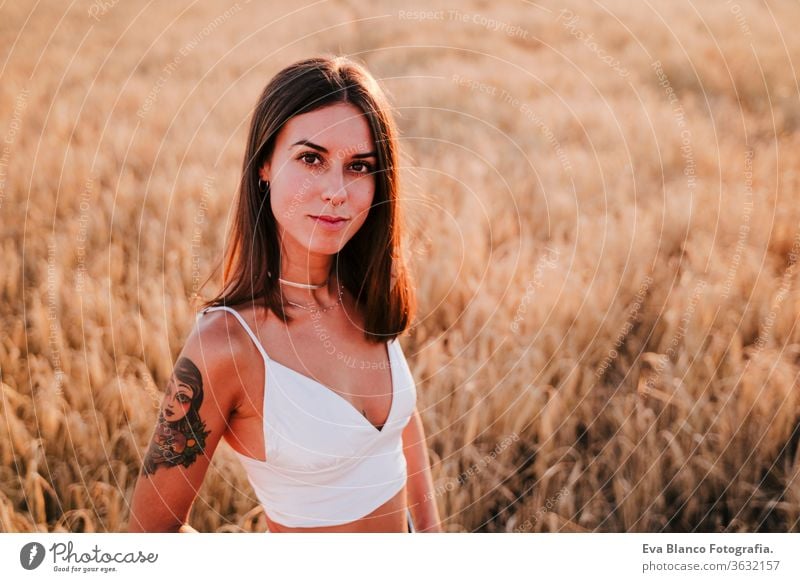 portrait of beautiful woman in a yellow field at sunset. Summer time relax sunrise caucasian blessing female carefree young lifestyle nature summer vitality