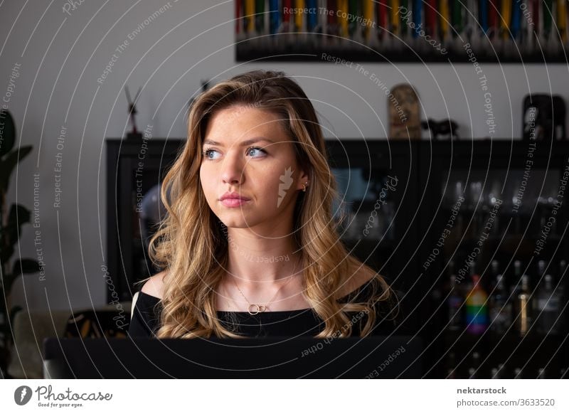 Young Blond Woman Looking Away in Living Room Portrait woman lifestyle blond young woman one woman only domestic life caucasian ethnicity 20-30 years old