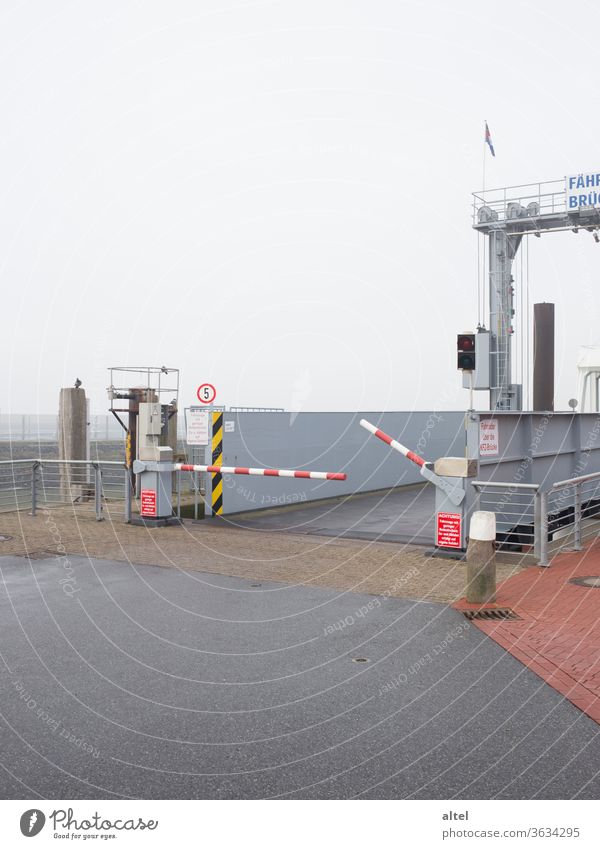 Departure 18:34 ferry bridge Ferry Off-Season Control barrier nebula Fog Ski-run Arrival North Sea North Sea Islands Harbour Wait Loneliness Passenger traffic