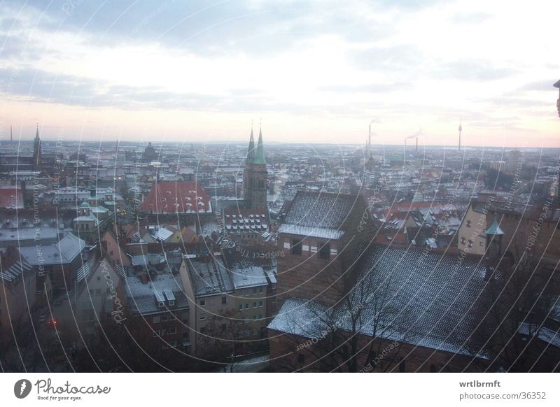 Nuremberg in the evening Far-off places Freedom Winter Snow Town Downtown Populated House (Residential Structure) Church Architecture Wall (barrier)