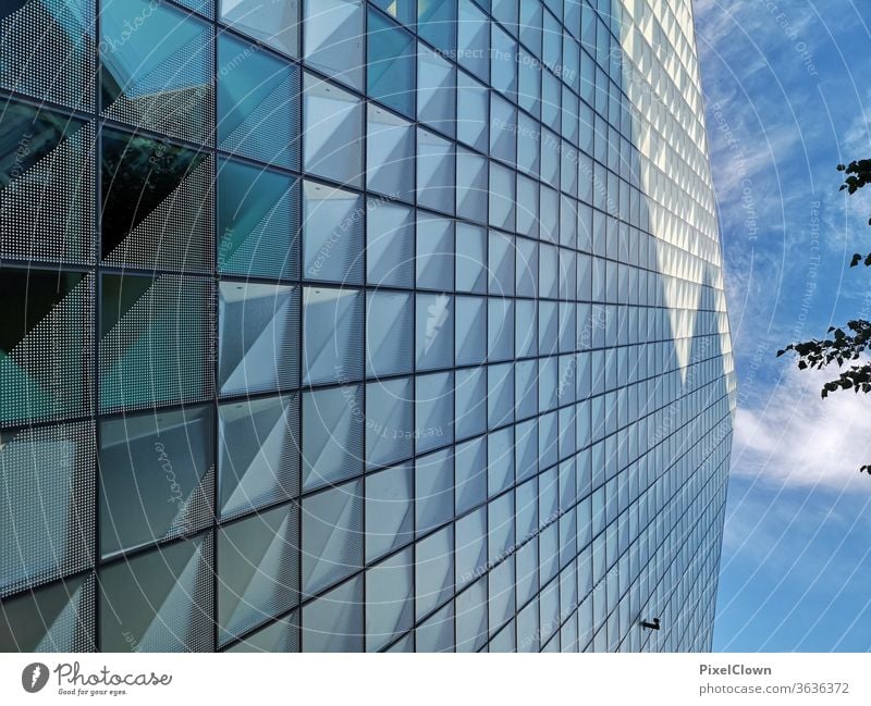 A skyscraper rises into the blue sky Facade Architecture House (Residential Structure) Sky Town Wall (building) Manmade structures built Deserted