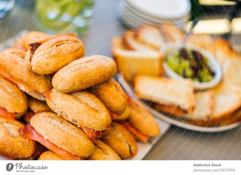 Closeup of delicious sandwiches on table bacon home party food meal plate snack fresh serve sweet tasty pastry gourmet cuisine yummy bread baked dessert