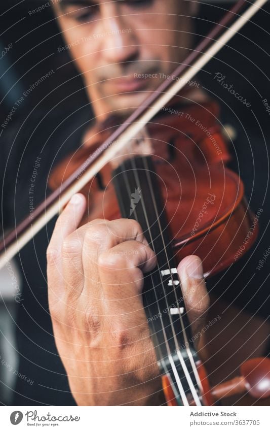 Ethnic male musician playing violin instrument man talent sheet violinist melody ethnic hispanic perform rehearsal sound entertain tune hobby rhythm player